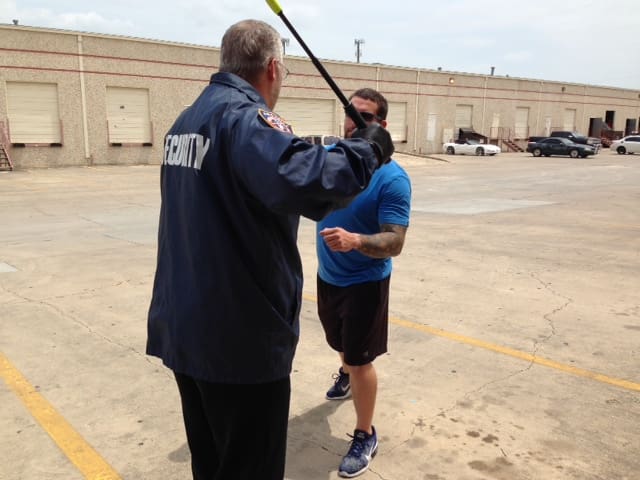 Ken Lewis, formally of National Protective Services Institute, NPSI, now with P3TC, Prevent Prepare Protect Training and Consulting, demonstrating baton tactics for the Texas PSP, Private Security Program.