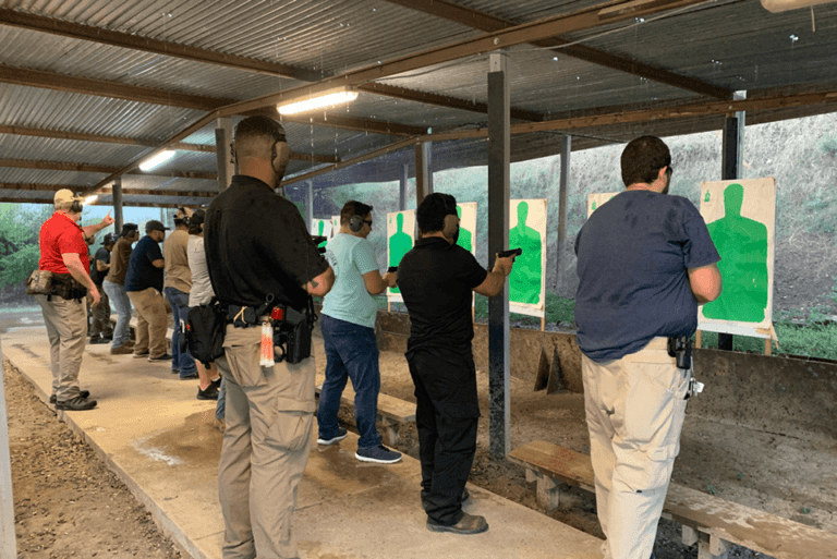 Group of Men at Gun Range with Safety Instructors