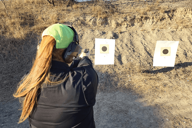 Woman in Green Cap at Gun Range